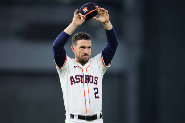 : Alex Bregman #2 of the Houston Astros waves to fans prior to playing the Detroit Tigers in Game