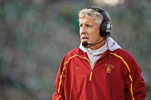  USC head coach Pete Carroll talks on his head set in game action. USC defeated Notre Dame