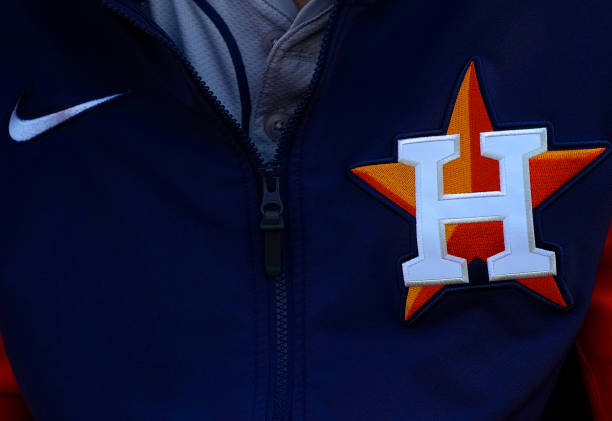  A detailed view of the Houston Astros logo shown on the jacket worn by Mauricio Dubón #14 against 