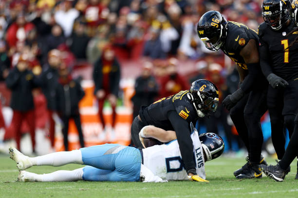 Dante Fowler Jr. #6 of the Washington Commanders reacts after a sack on Will Levis #8 of the Tennessee Titans in the third quarter of a game at Northwest Stadium