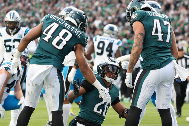 Saquon Barkley #26 of the Philadelphia Eagles celebrates after scoring a two-point conversion in the fourth quarter of a game against